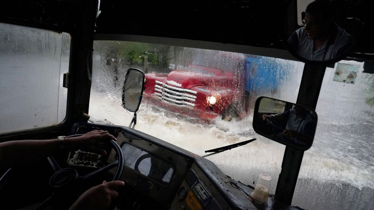 A truck passes on a flooded street Tuesday as Idalia makes landfall in Cuba.