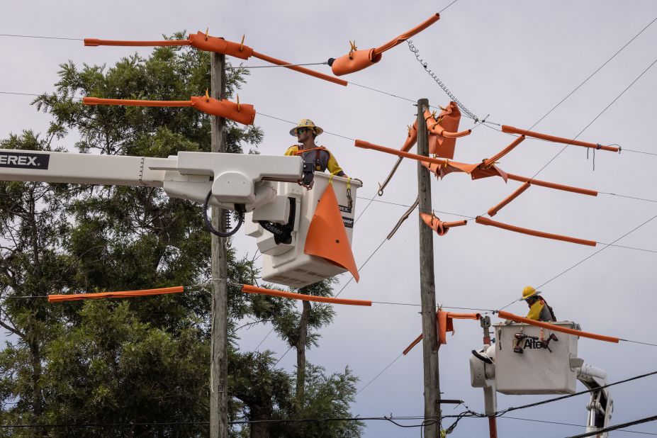 Pike Electric workers fortify power lines in Clearwater, Florida, on Tuesday, August 29.