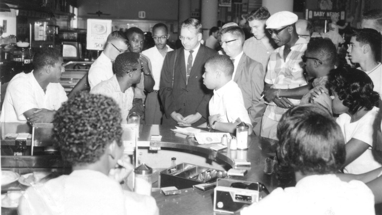 A 16-year-old Rodney Hurst can be seen seated at the counter between two men standing prior to the violent attack on August 27, 1960.