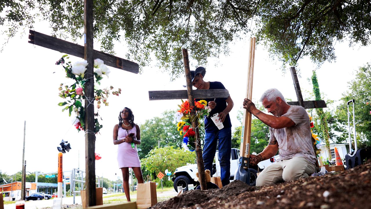 Mourners make memorials Monday for the victims of the attack at a Dollar General store in Jacksonville, Florida.