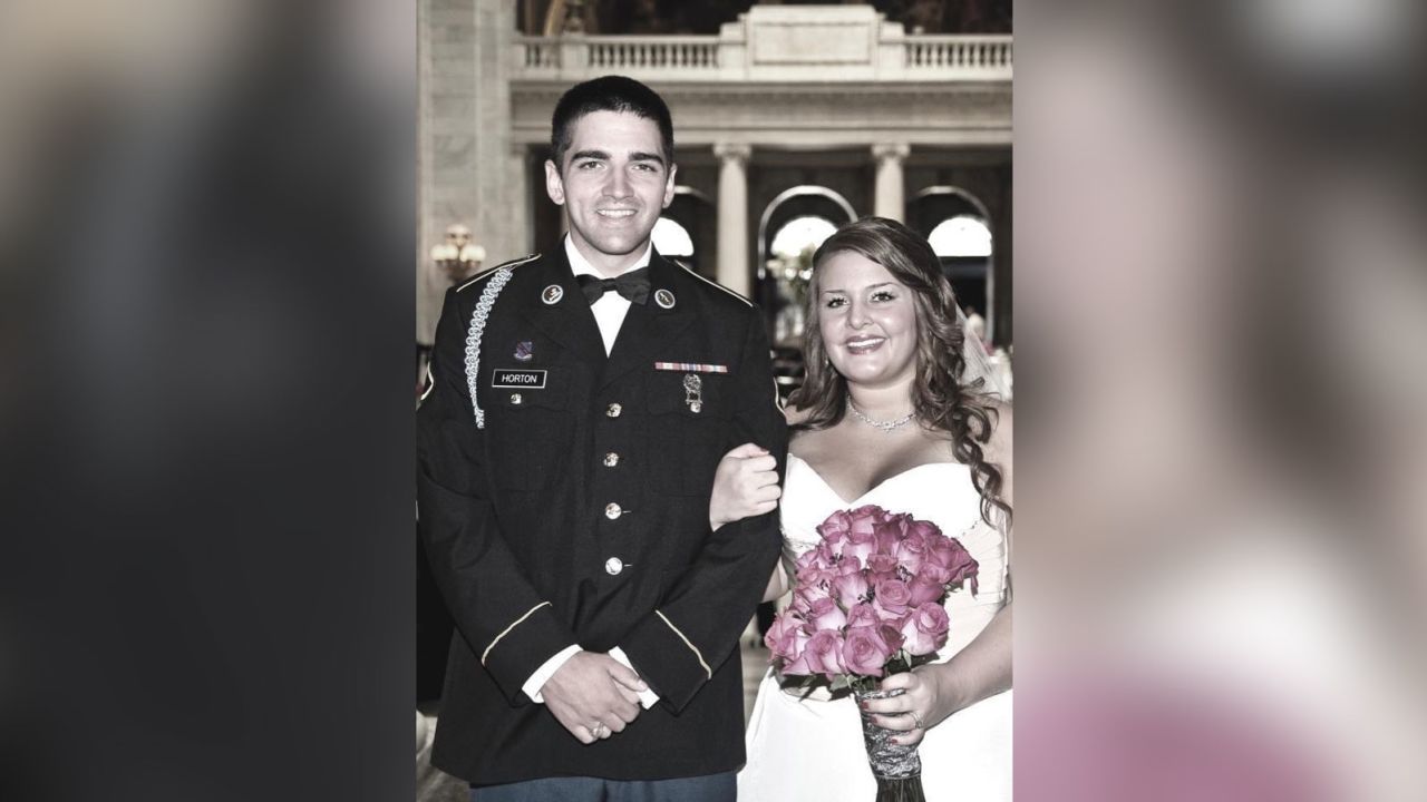 Spc. Chris Horton and Jane Horton pose for a photo on their wedding day in 2009 in Cleveland, Ohio.