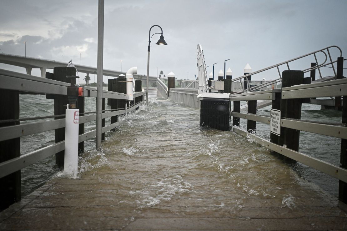 A boardwalk at the Clearwater Harbor Marina in Florida, is flooded by the rising tide Wednesday.