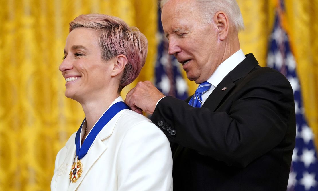 U.S. President Joe Biden awards the Presidential Medal of Freedom to U.S. Women's National Soccer Team player soccer player Megan Rapinoe during a ceremony at the White House in Washington, U.S., July 7, 2022. REUTERS/Kevin Lamarque