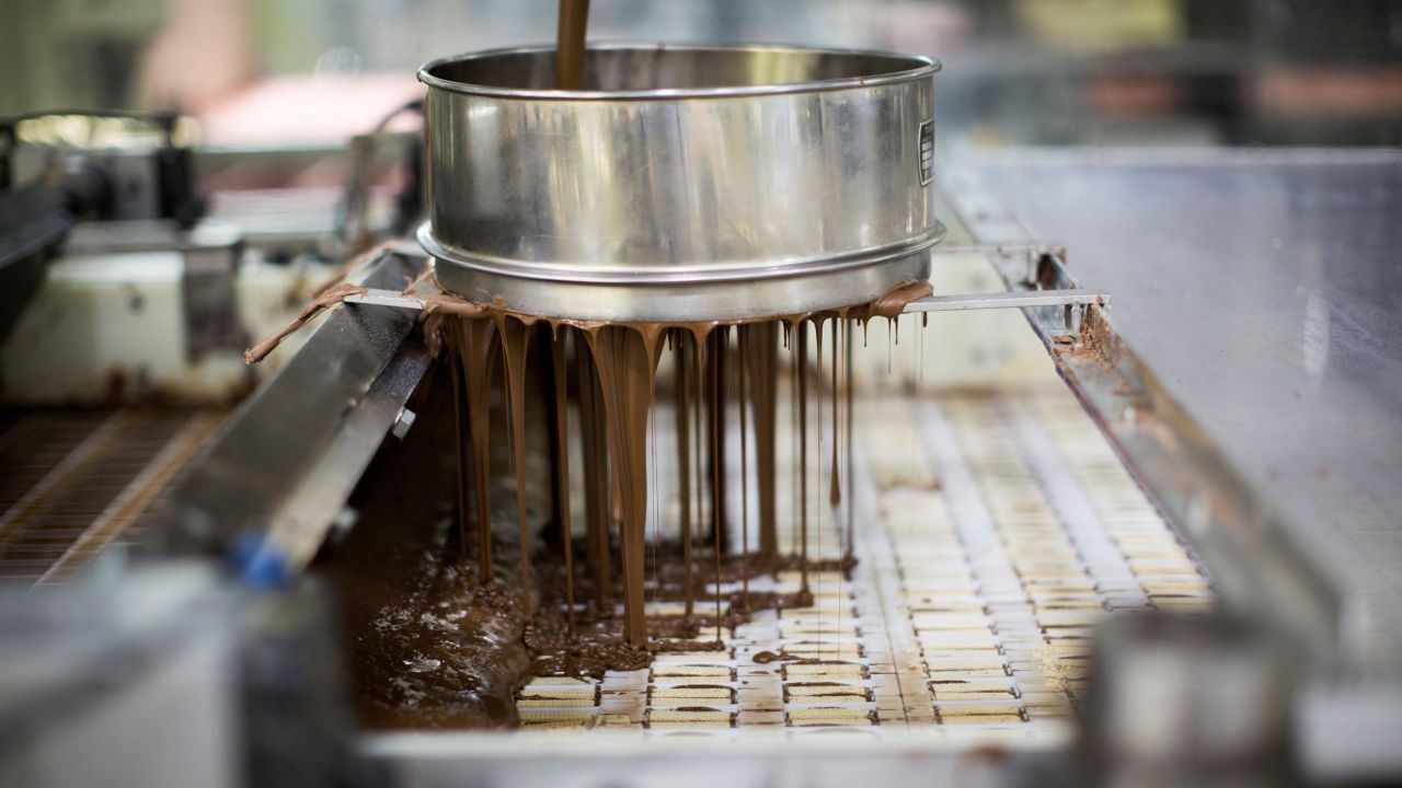 Chocolate is poured on wafer bars at a Kit Kat factory in Japan.