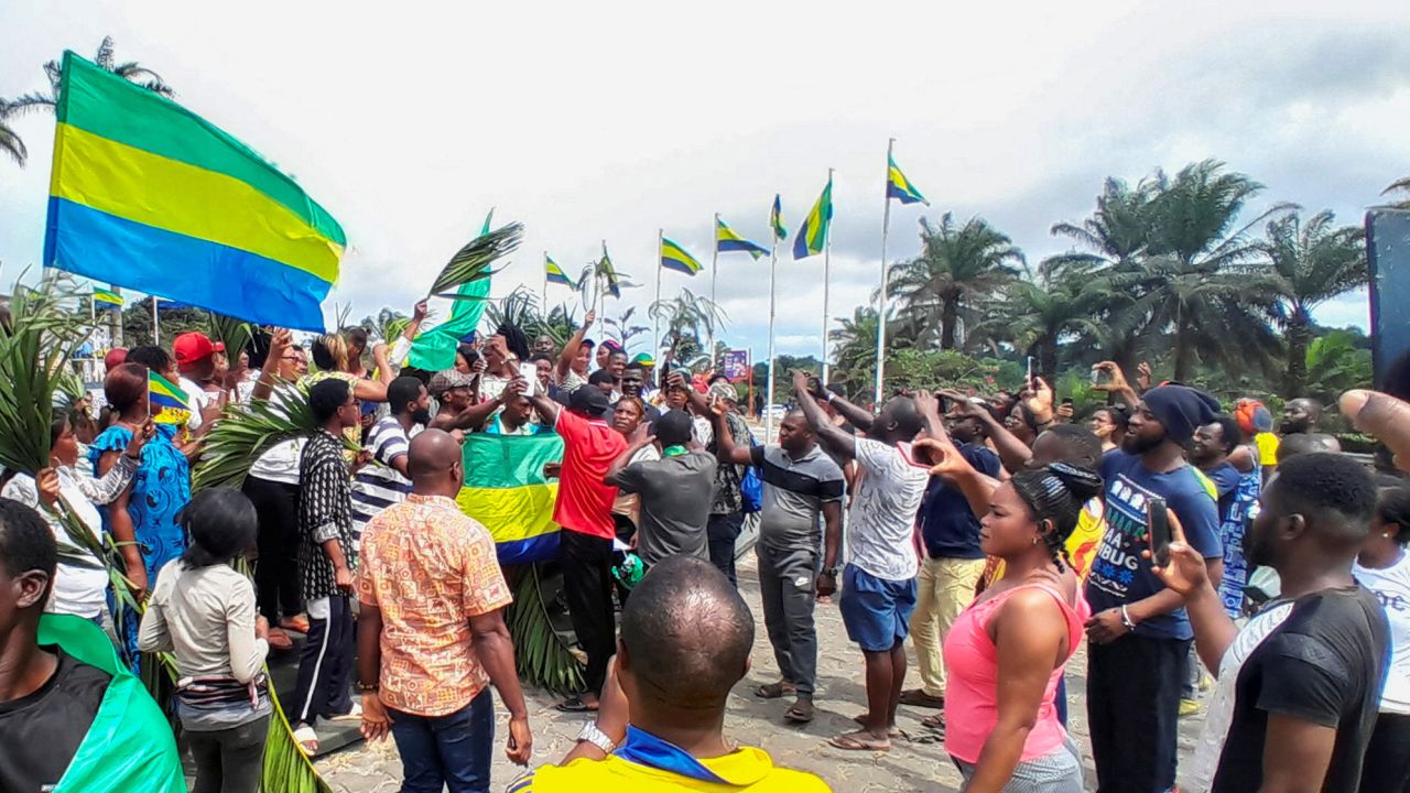 People celebrate in support of the military coup leaders in Libreville, Gabon on Wednesday.