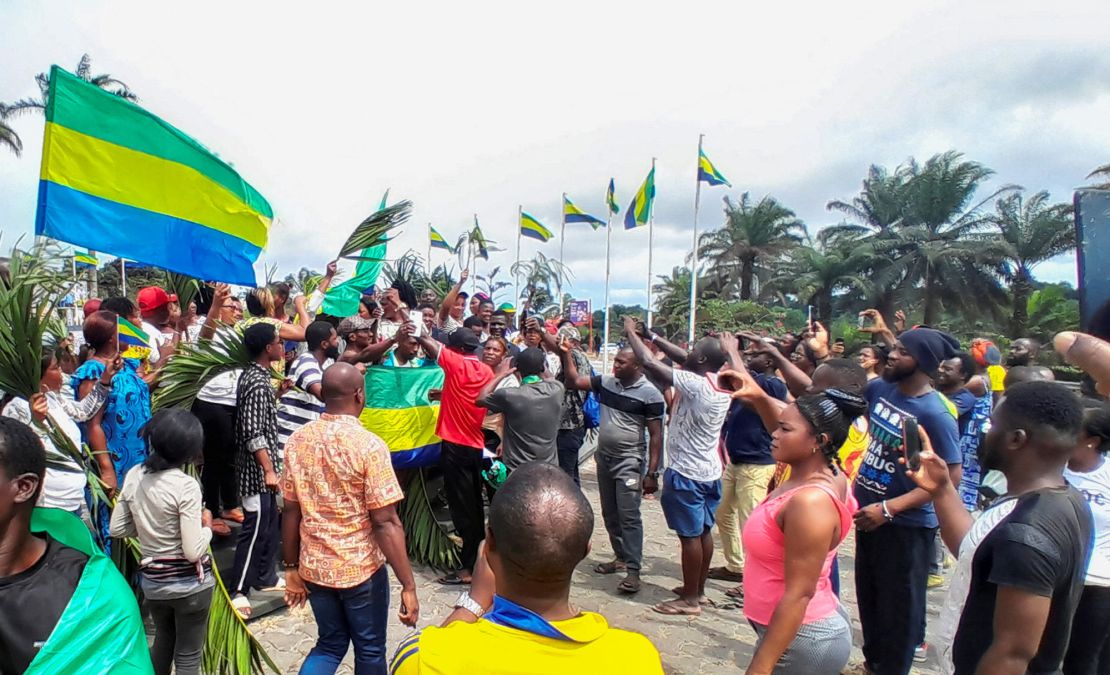 People celebrate following a military coup in Libreville, Gabon, on August 30.