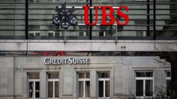 A sign of Credit Suisse bank is seen behind a sign of Swiss banking UBS, in Zurich on March 18, 2023. - Switzerland's largest bank, UBS, is in talks to buy all or part of Credit Suisse, according to a report by the Financial Times. Credit Suisse -- Switzerland's second-biggest bank -- came under pressure this week as the failure of two US regional lenders rocked the sector. (Photo by Fabrice COFFRINI / AFP) (Photo by FABRICE COFFRINI/AFP via Getty Images)