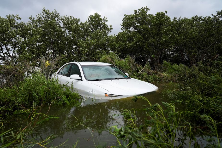 A vehicle is partially submerged in Cedar Key, Florida, on August 30.