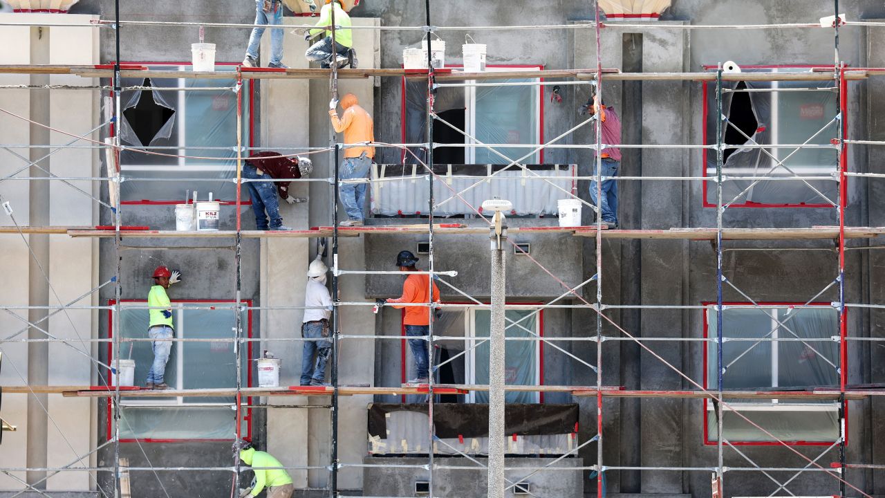 LOS ANGELES, CALIFORNIA - JULY 12: Construction workers stand on scaffolding while building residential housing on July 12, 2023 in Los Angeles, California. According to the Bureau of Labor Statistics, the U.S. economy added 209,000 jobs in June in a sign of a slowing economy amid the Federal Reserve's inflation-fighting campaign. (Photo by Mario Tama/Getty Images)