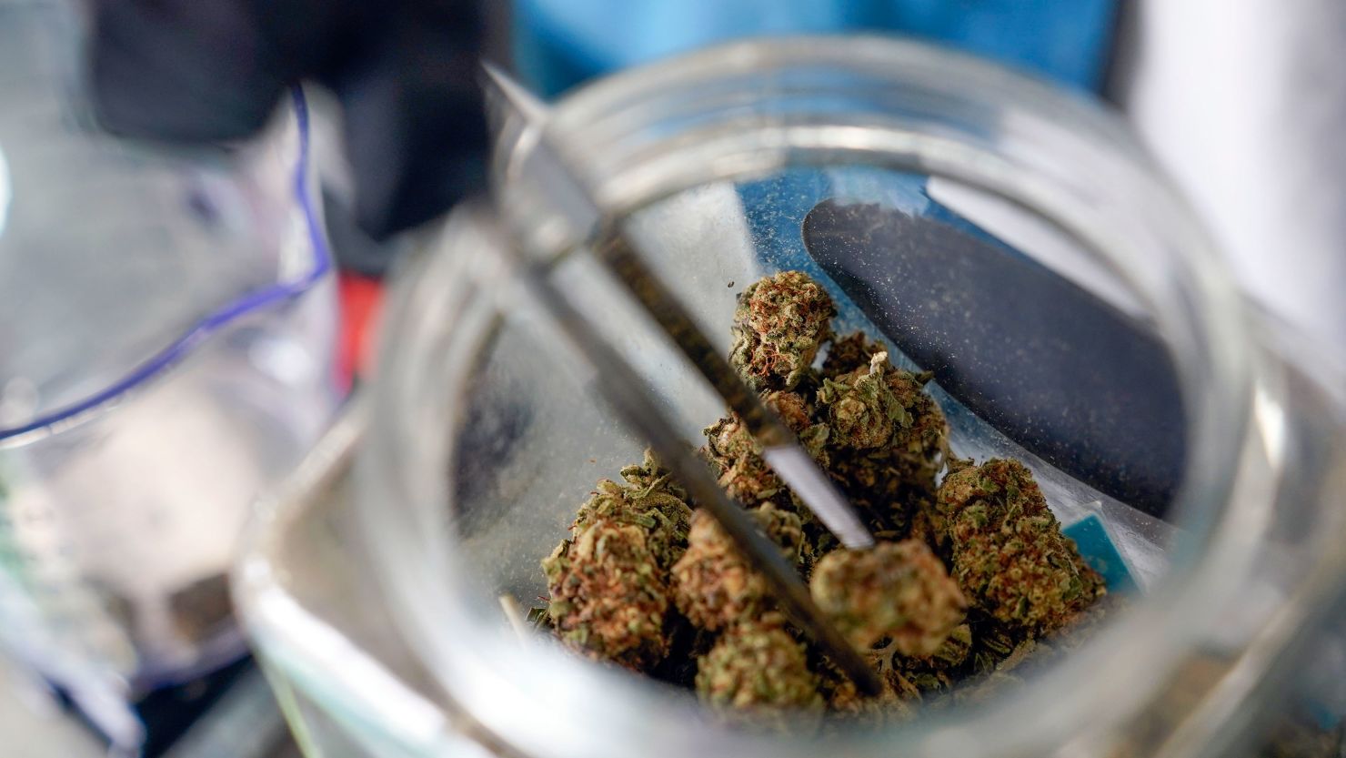 An employee at the Good Leaf Dispensary measures out marijuana for a customer on the reservation Mohawks call Akwesasne, Monday, March 14, 2022 in St. Regis, New York.