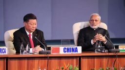 China's President Xi Jinping and India's Prime Minister Narendra Modi attend a session meeting during the 10th BRICS summit on July 27, 2018 in Johannesburg, South Africa. 
