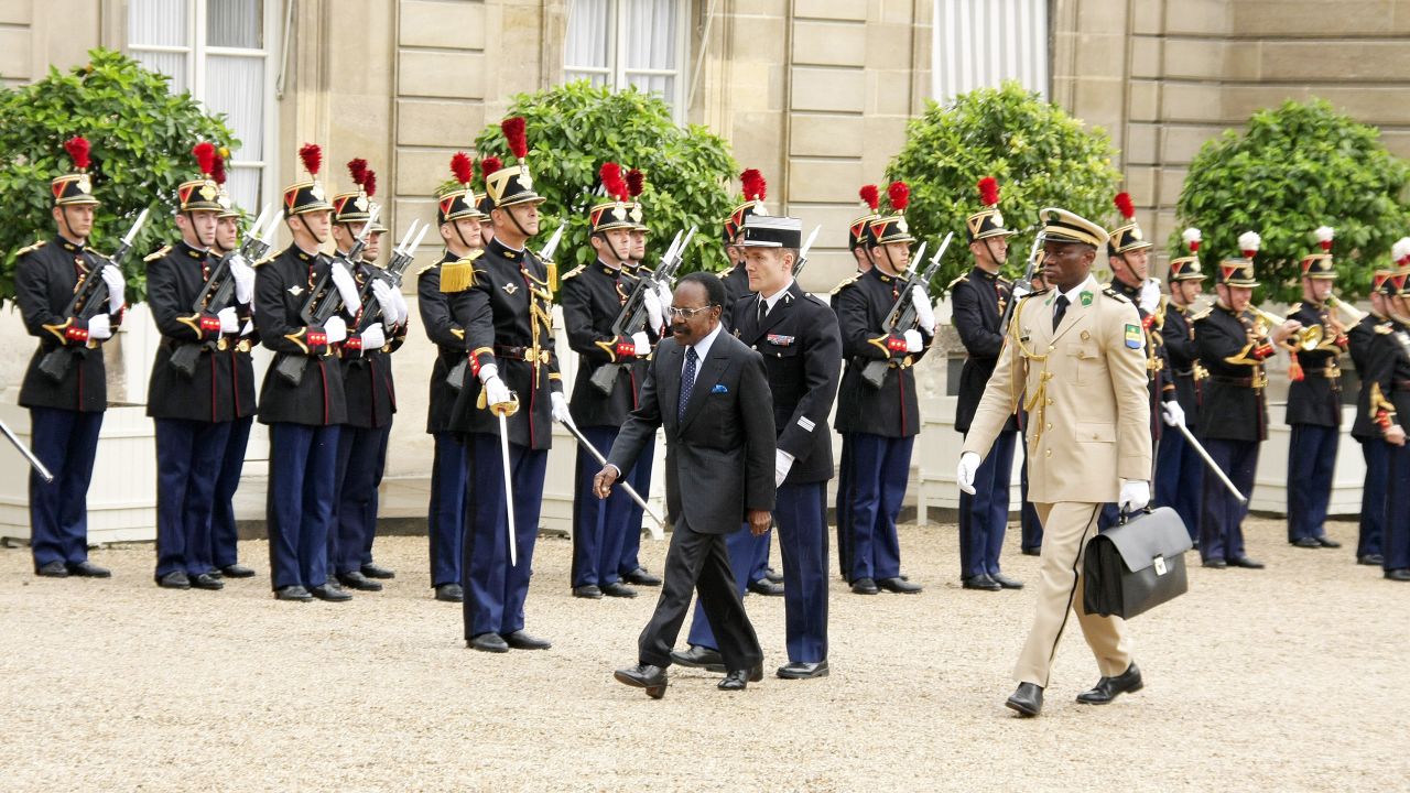 Gabon's then-President Omar Bongo Ondimba with bodyguard Brice Oligui Nguema and French President Nicolas Sarkozy in Paris on July 2, 2008.