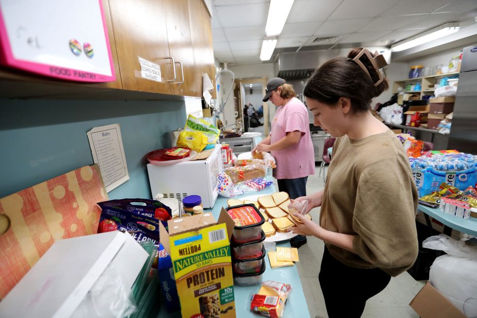 Samarra Mullis, right, and Jack Lemburg make sandwiches for residents who sought shelter at St. Michael's and All Angels Episcopal Church in Savannah, Georgia, on August 30.