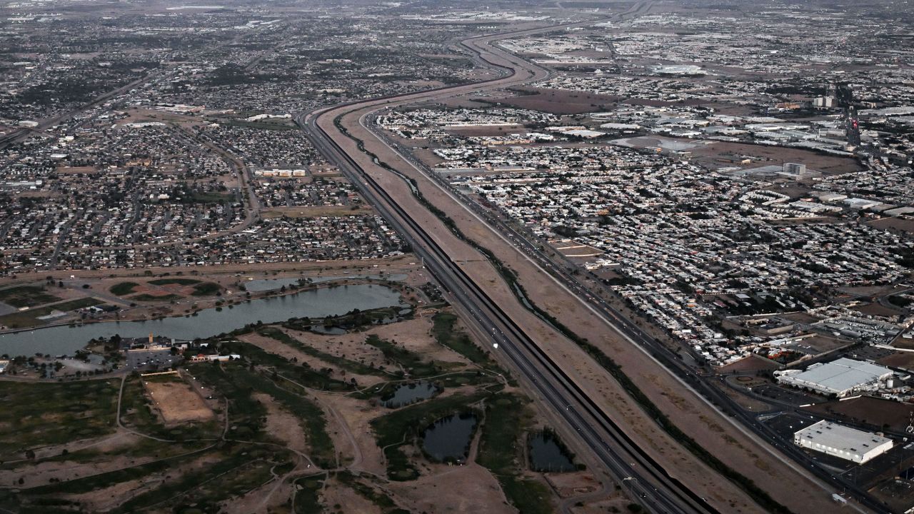 This aerial image from  May 12 shows a border wall and concertina wire barriers standing along the Rio Grande between El Paso, Texas, left, and Ciudad Juarez, Mexico.
