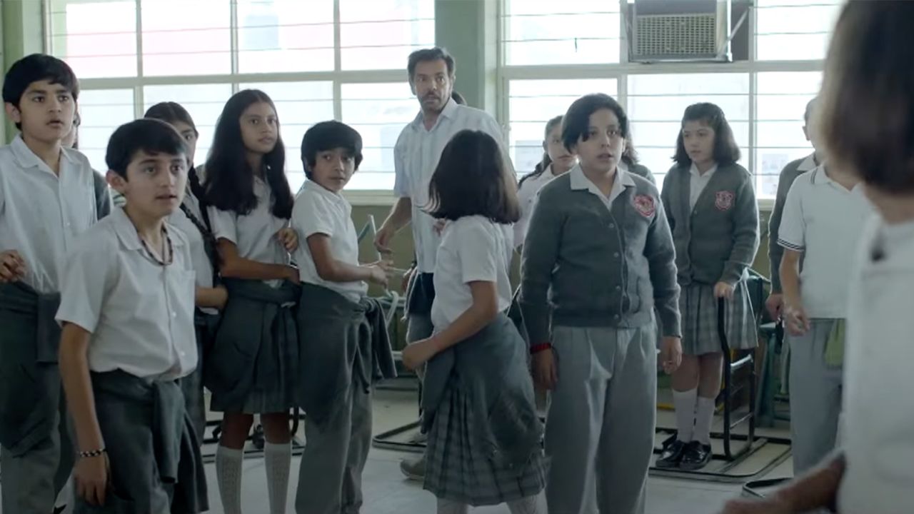 Eugenio Derbez (center, background) in a still from "Radical."