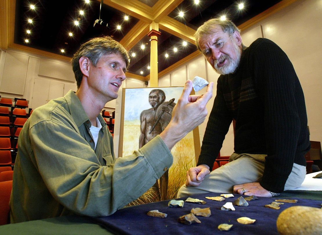 (AUSTRALIA OUT) The team involved in discovering the 'hobbit', Homo floresiensis, a miniature human species on the Indonesian island of Flores, were in Sydney, at the Australian Museum, to talk about the discovery, 28 October 2004. Pic shows (left to right) Professor Bert Roberts, Uni of Wollongong, and Professor Mike Morwood, Uni. of New England, with artifacts from the site. SMH Picture by ROBERT PEARCE (Photo by Fairfax Media via Getty Images/Fairfax Media via Getty Images via Getty Images)