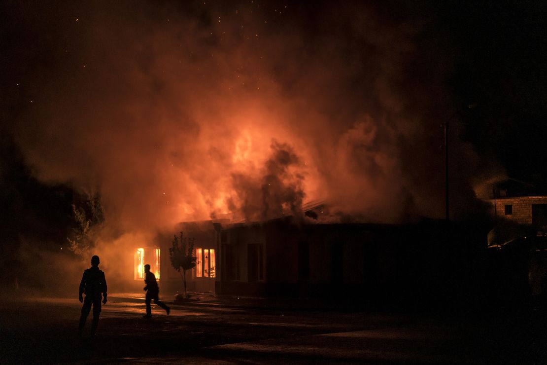 A fire burns in a hardware store after a rocket attack caused the building to catch fire on October 3, 2020 in Stepanakert, Nagorno-Karabakh. 