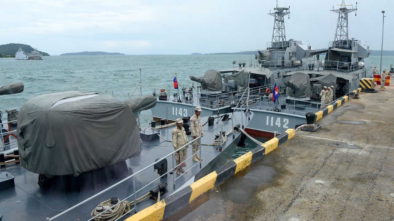 Cambodian naval personnel are seen on boats berthed at a jetty at the Ream naval base in Preah Sihanouk province on July 26, 2019, during a government-organized media tour. 