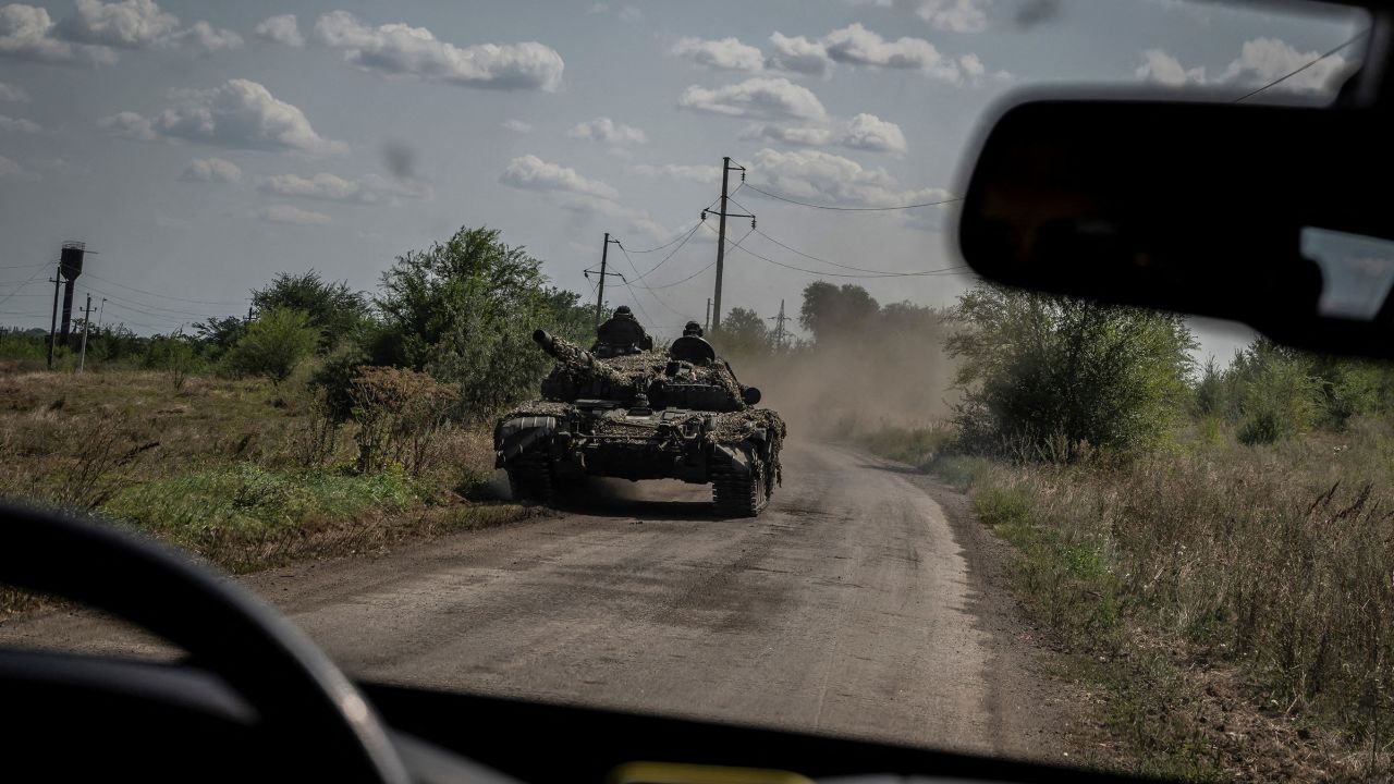 Ukrainian soldiers ride a tank near Robotyne,  a village that Kyiv took last week amid a slow and grueling counteroffensive against dense Russian defense lines.  