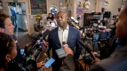 Sen. Tim Scott speaks to reporters at Robie's Country Store, a traditional campaign stop in Hooksett, New Hampshire, on Friday, August 25, 2023. 
