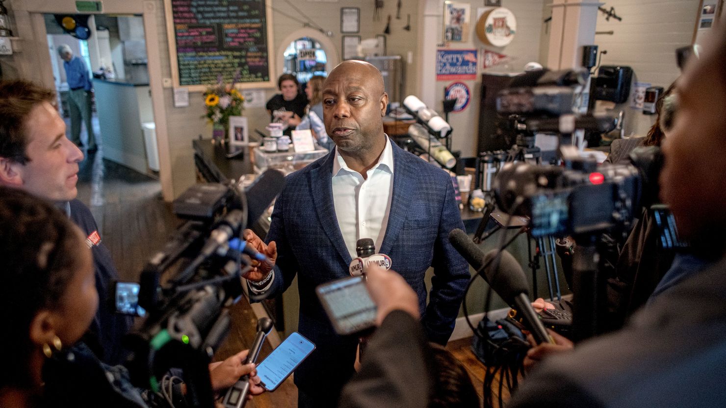 South Carolina Sen. Tim Scott speaks to reporters at a campaign stop in Hooksett, New Hampshire, on August 25, 2023. 