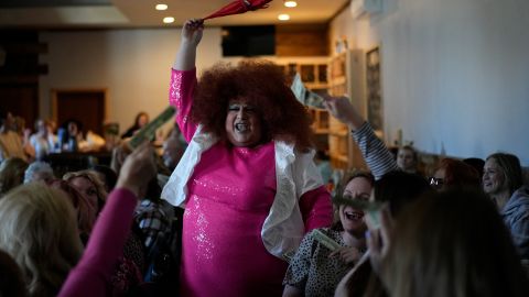 The audience sings along and holds up cash tips for drag queen Alexus Daniels at "Spring Fever Drag Brunch," Sunday, March 26, 2023, at the Kulpmont Winery in Kulpmont, Pa. (AP Photo/Carolyn Kaster)