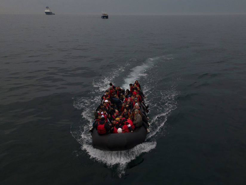 A boat carrying around 50 migrants drifts into English waters after being escorted from the French coastline on Thursday, August 24. Over 100,000 migrants have crossed the English Channel from France into England on small boats since the UK began publicly recording the arrivals in 2018.