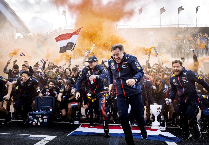 Dutch driver Max Verstappen celebrates his <a href="https://www.cnn.com/2023/08/28/motorsport/max-verstappen-formula-1-dutch-spt-intl/index.html" target="_blank">Dutch Formula One Grand Prix win</a> with members of the Red Bull Racing team in Zandvoort, Netherlands, on Sunday, August 27. Verstappen's win was his eleventh of the season and ninth in a row, drawing him level with Sebastian Vettel for the most consecutive victories in F1 history.