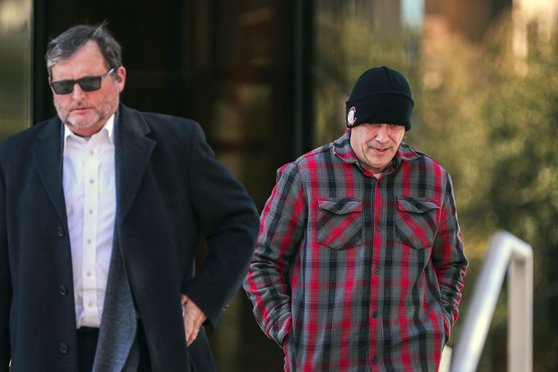 Chad Stark, right, follows his attorney Horatio Aldredge out of the United States Federal Courthouse after a hearing, January 21, 2022, in Austin, Texas. 