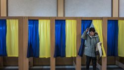 KIEV, UKRAINE - MARCH 31: A voter emerges from the voting booth after filling out her ballot for Ukraine's presidential election on March 31, 2019 in Kiev, Ukraine. If no candidate receives more than 50% of the vote, the top two vote-getters will face off in a second-round election on April 21. (Photo by Brendan Hoffman/Getty Images)