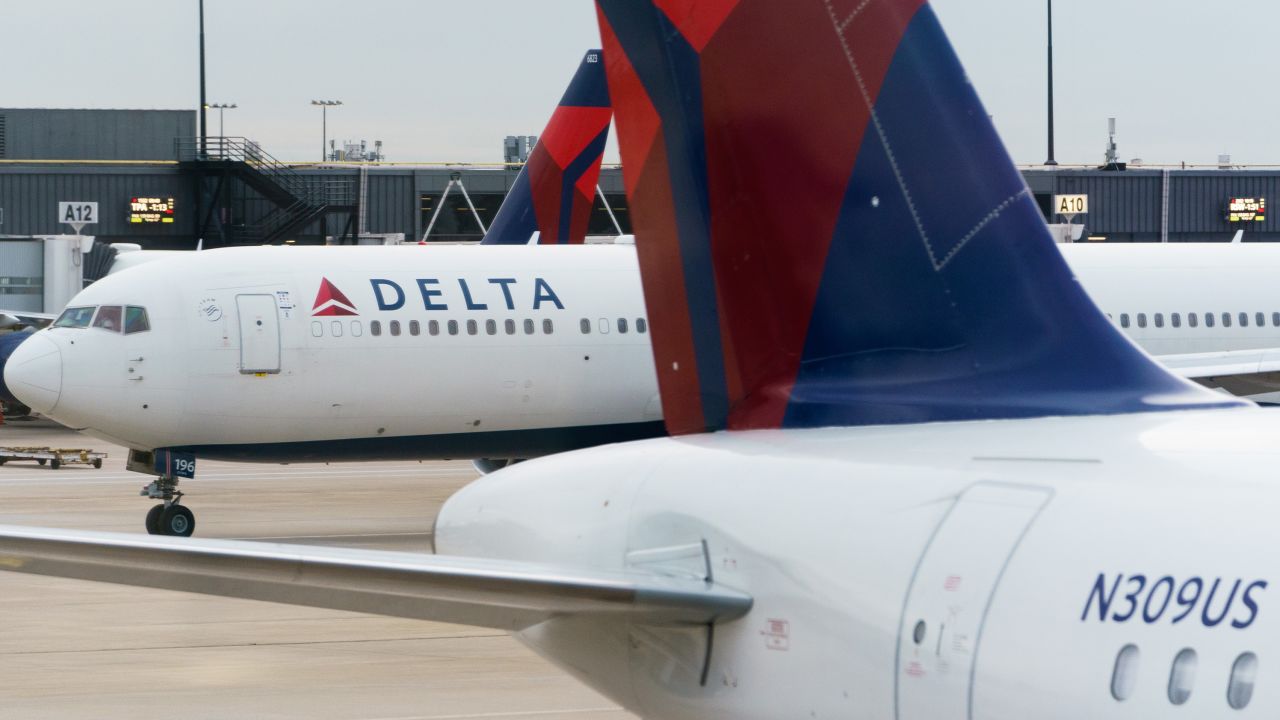 Delta Air Lines airplanes at the Hartsfield-Jackson Atlanta International Airport (ATL) in Atlanta, Georgia, U.S., on Tuesday, Dec. 21, 2021. Airline passenger numbers in the U.S. totaled 2.12 million on Dec. 19, compared with 1.06 million the same weekday a year earlier, according to the Transportation Security Administration. Photographer: Elijah Nouvelage/Bloomberg via Getty Images