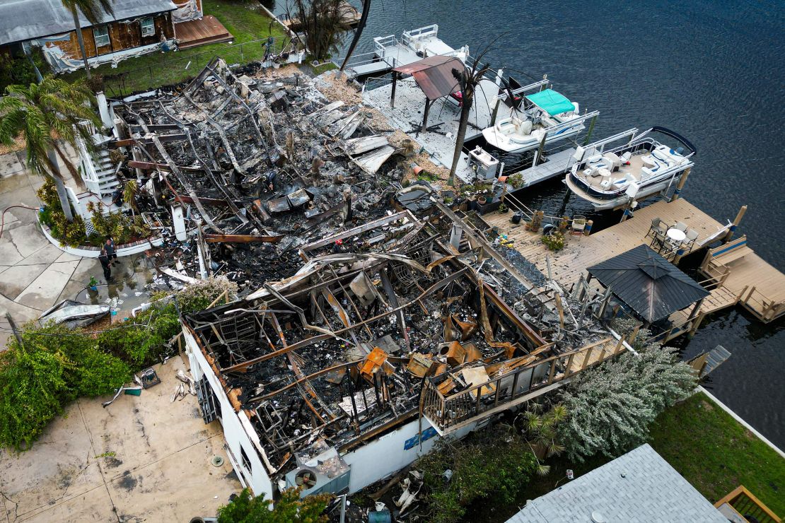 Aerial view of the charred remains of a house that burned down after a power transformer explosion Wednesday in Hudson, Florida.