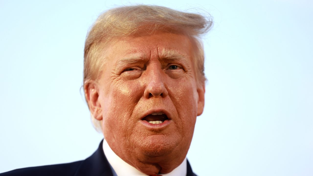 Former U.S. President Donald Trump speaks to the media at Atlanta Hartsfield-Jackson International Airport after being booked at the Fulton County jail on August 24, 2023 in Atlanta, Georgia. 