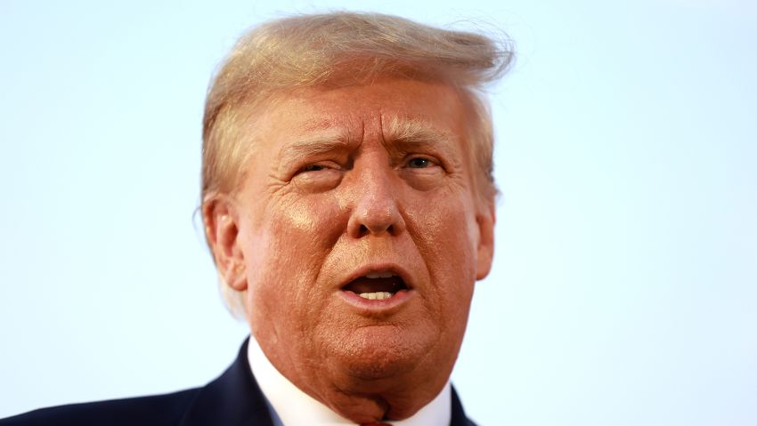 Former U.S. President Donald Trump speaks to the media at Atlanta Hartsfield-Jackson International Airport after being booked at the Fulton County jail on August 24, 2023 in Atlanta, Georgia.