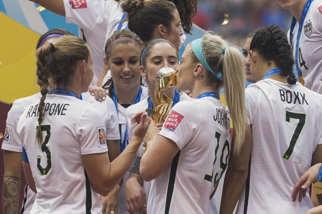 United States' defender Julie Johnston (19) and midfielder Morgan Brian (14) kiss the Women's World Cup trophy after 5-2 victory over Japan in the final match, Monday July 13, 2015 in Vancouver, British Columbia. (Mo Khursheed/TFV Media via AP Images) MANDATORY CREDIT
