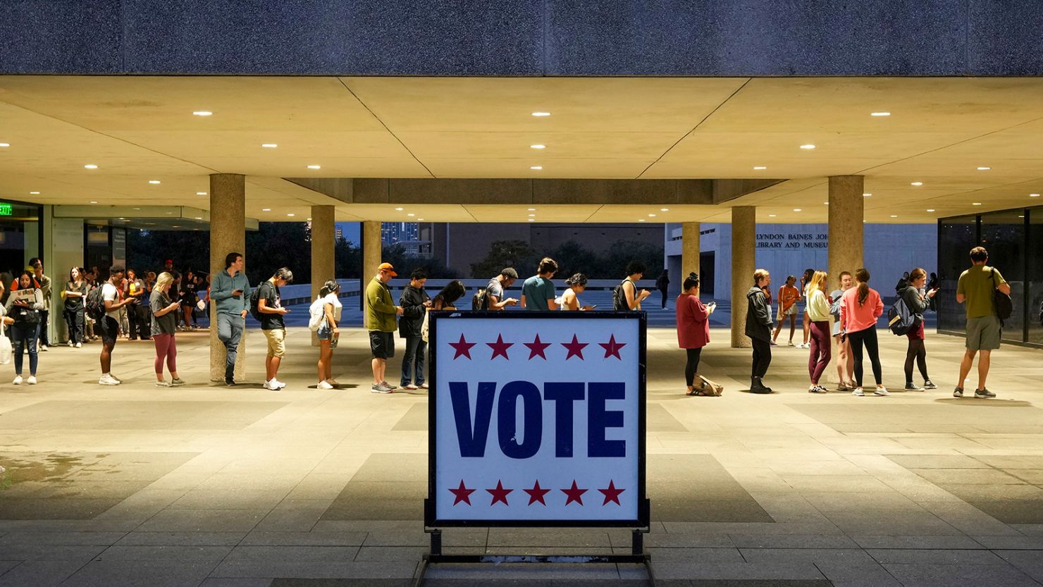 Voters wait in line at a polling place at the Lyndon B. Johnson School of Public Affairs in Austin, Texas, on election night, November 8, 2022. 