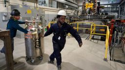 File - Workers transport equipment at Boston Metal on Jan. 25, 2023, in Woburn, Mass. On Friday, the U.S. government issues the August jobs report. (AP Photo/Steven Senne, File)