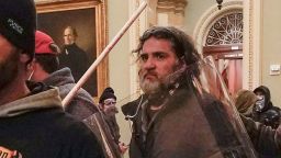 Rioters, including Dominic Pezzola, center with police shield, are confronted by U.S. Capitol Police officers outside the Senate Chamber inside the Capitol, Wednesday, Jan. 6, 2021, in Washington, DC. 