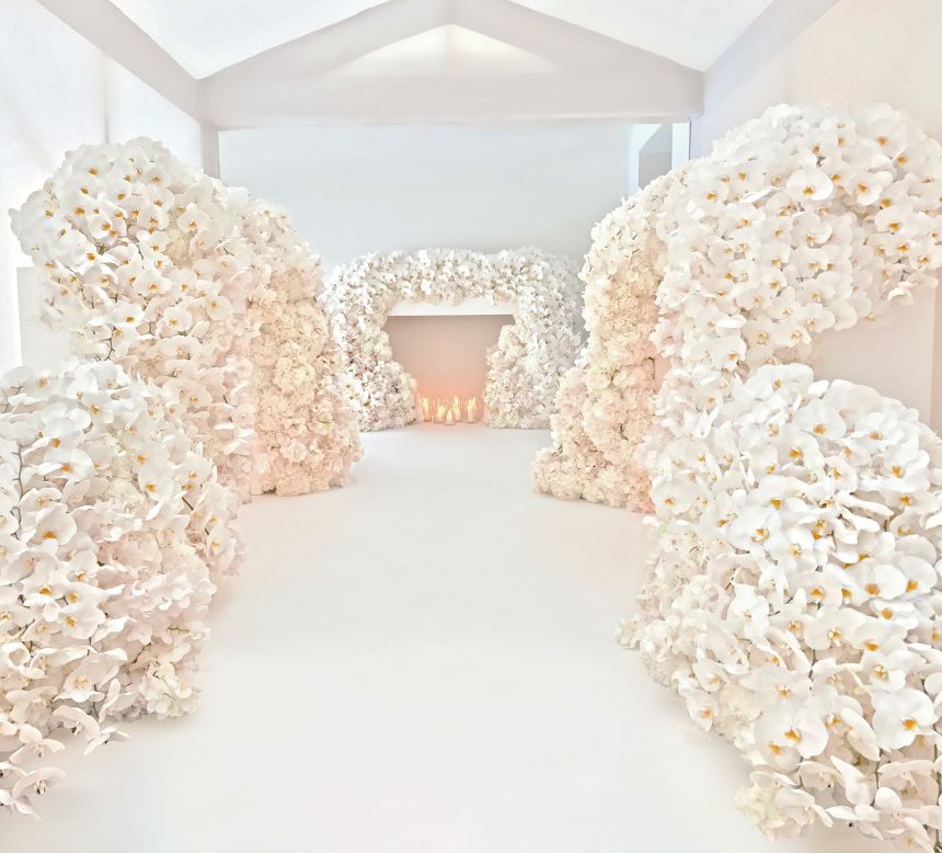 White hydrangeas, orchids and roses installed at a private wedding in Woodstock, England.