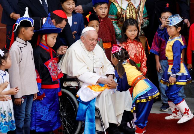 Pope Francis greets a child during a welcoming ceremony in Ulaanbaatar, Mongolia, in September 2023.