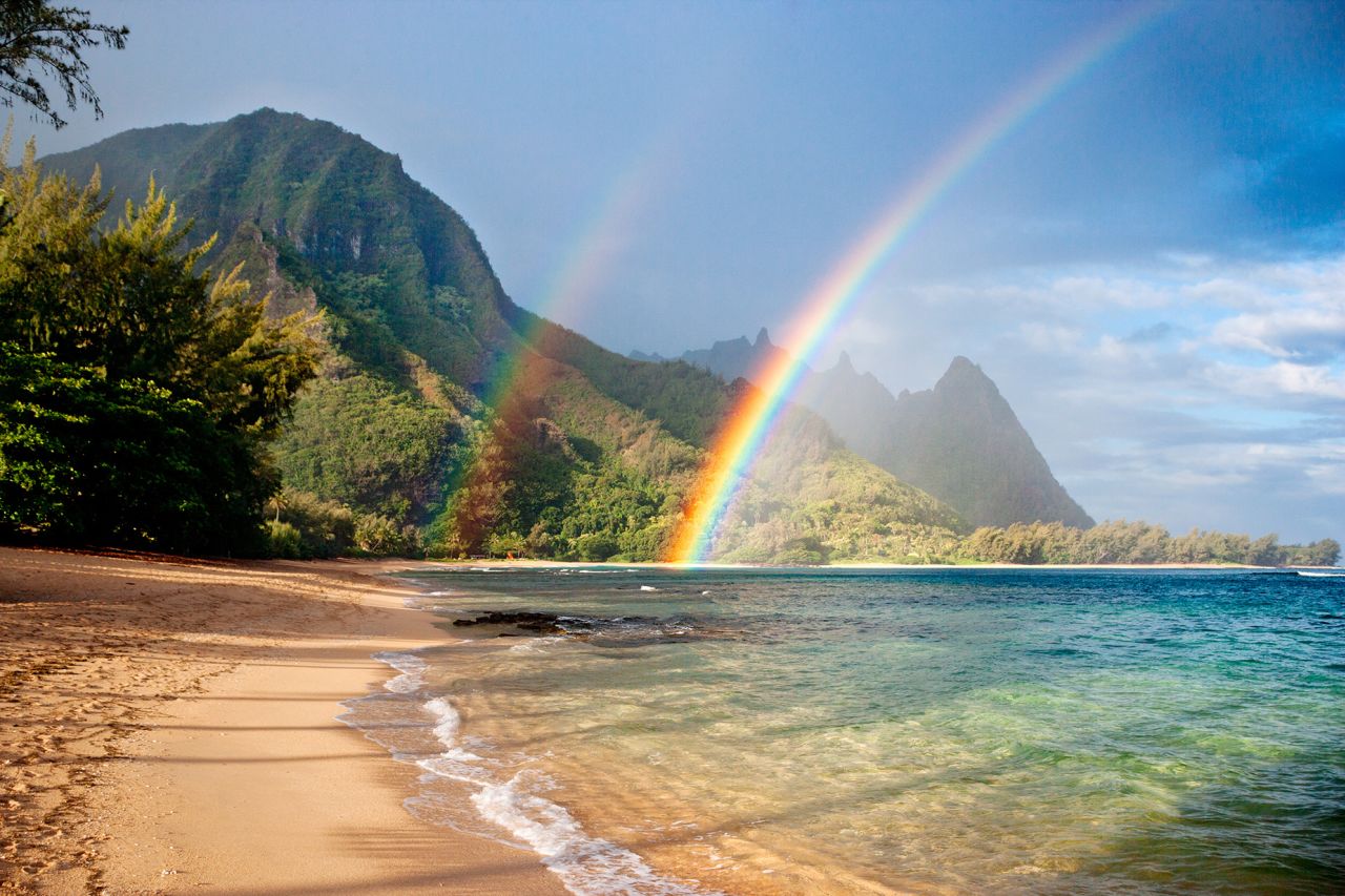 double rainbow at tunnels beach in kauai, hawaii