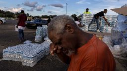 Phillip Young, a local resident from Jackson, Mississippi, takes a break while helping local volunteers distribute bottles of water as the city and areas around it go without reliable drinking water indefinitely after pumps at the water treatment plant failed on August 31, 2022. 
