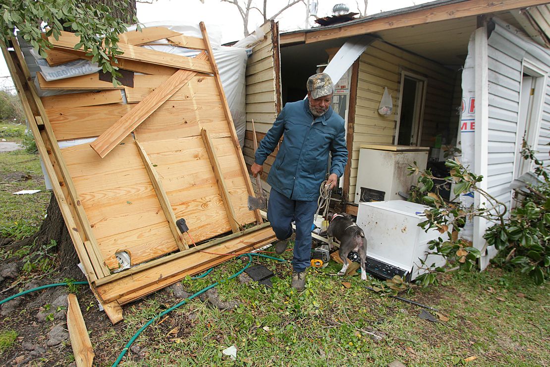 Semler Street resident Mack Robinson checks on his tornado-damaged home in 2012 in Prichard, Alabama. 