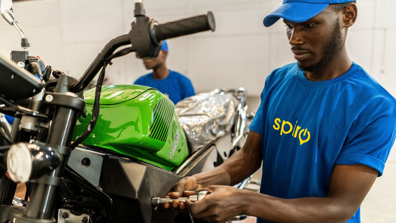 A mechanic assembles electric motorcycle taxis serving a fleet of 200 drivers in Rwanda with motorbikes provided by the company "Spiro", at the company warehouse in Kigali on June 2, 2023. The bikes are designed to be sustainable and affordable and come as an answer to the challenges facing the African continent with regard to the fight against pollution and global warming. Spiro is a leading provider of electric two-wheelers in Africa with nearly 10,000 electric bikes on the road. Headquartered in Benin, the startup is also operating in Togo, Rwanda, and Uganda where it signed a partnership agreement with the government for the deployment of 140,000 electric two-wheelers. The startup is also working closely with the Government of Rwanda on a framework agreement to fast-track the process of building an assembly plant in the country in the coming months. (Photo by Clement DI ROMA / AFP) (Photo by CLEMENT DI ROMA/AFP via Getty Images)