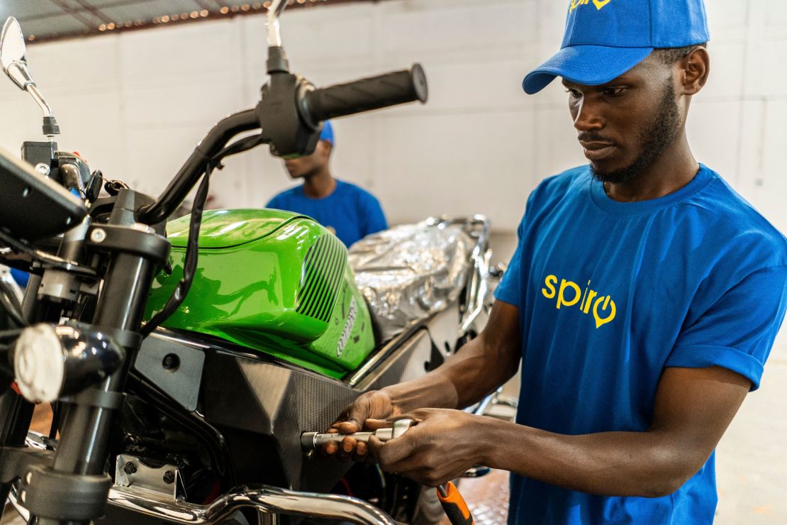 A mechanic assembles electric motorcycle taxis serving a fleet of 200 drivers in Rwanda with motorbikes provided by the company "Spiro", at the company warehouse in Kigali on June 2, 2023. The bikes are designed to be sustainable and affordable and come as an answer to the challenges facing the African continent with regard to the fight against pollution and global warming. Spiro is a leading provider of electric two-wheelers in Africa with nearly 10,000 electric bikes on the road. Headquartered in Benin, the startup is also operating in Togo, Rwanda, and Uganda where it signed a partnership agreement with the government for the deployment of 140,000 electric two-wheelers. The startup is also working closely with the Government of Rwanda on a framework agreement to fast-track the process of building an assembly plant in the country in the coming months. (Photo by Clement DI ROMA / AFP) (Photo by CLEMENT DI ROMA/AFP via Getty Images)