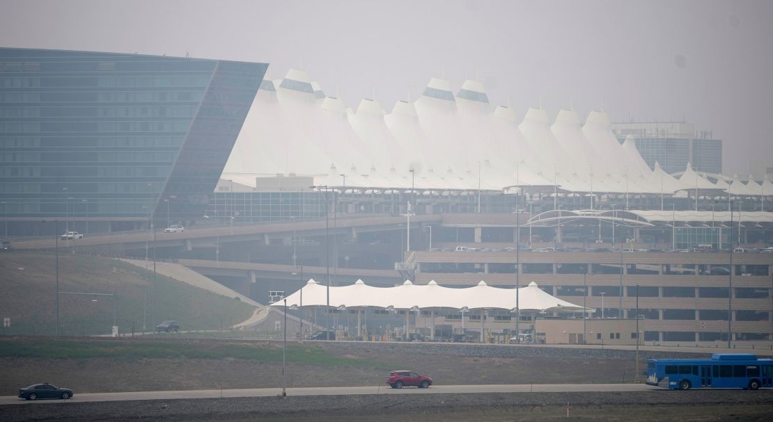 Heavy smoke shrouds a terminal at the Denver International Airport.