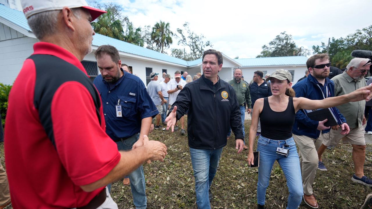 Florida Gov. Ron DeSantis, shakes hands with a man as he visits a church, home, and businesses damaged during the passage of Hurricane Idalia one day earlier, in Horseshoe Beach, Fla., Thursday, Aug. 31, 2023. (AP Photo/Rebecca Blackwell)