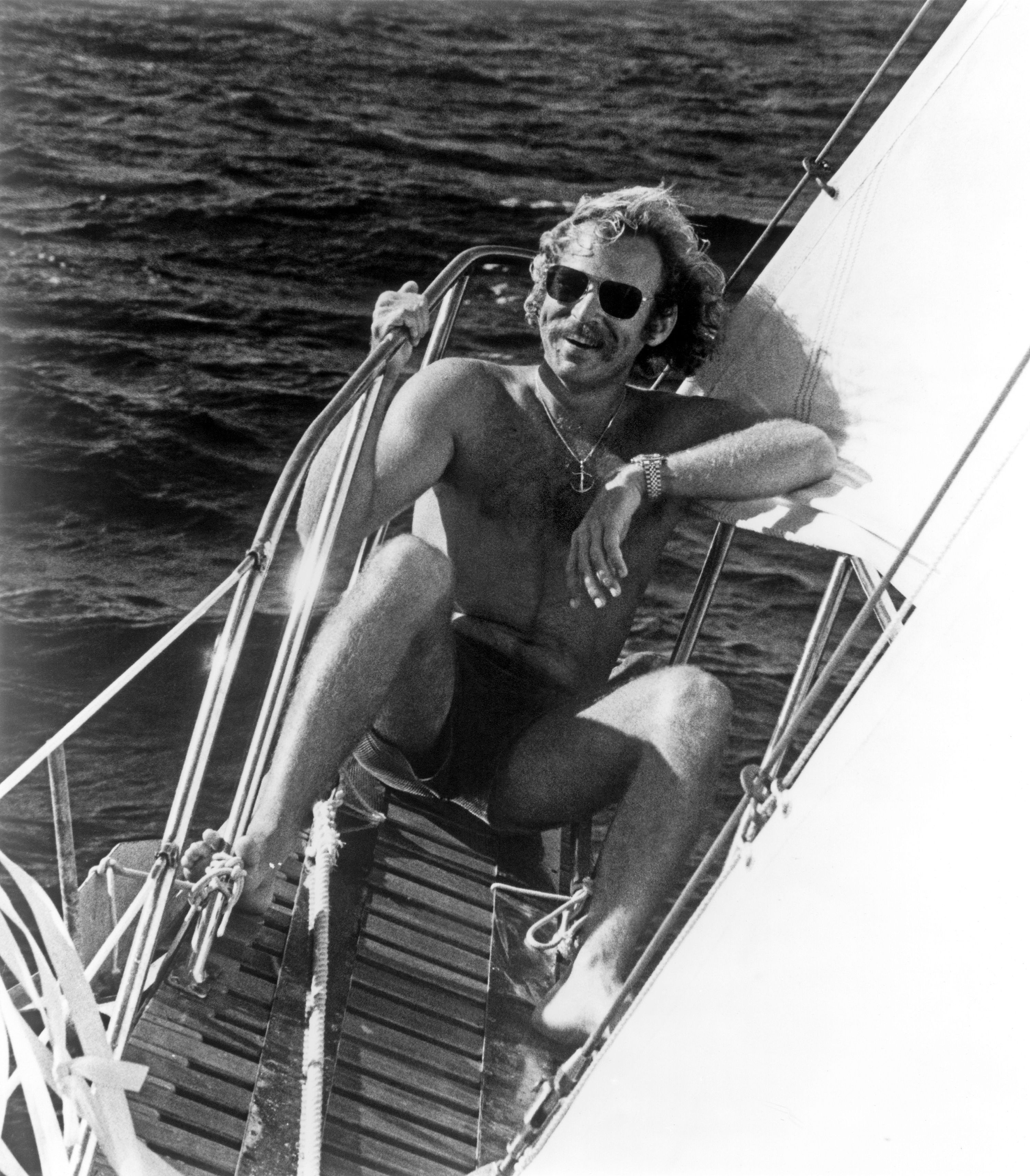 Buffett poses for a photo on his sailboat in 1975.