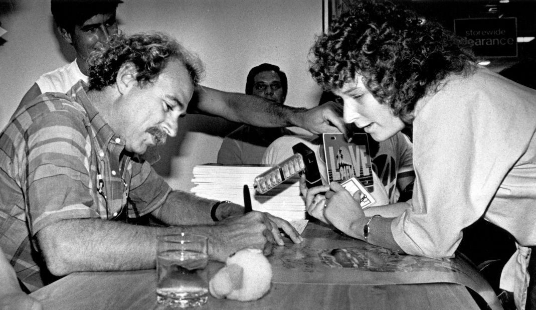 Buffett signs an autograph for a fan in Palm Beach, Florida in 1984.
