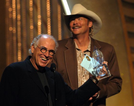 Buffett and Alan Jackson accept an award for their song "It's 5 O'Clock Somewhere" at the 2003 Country Music Association Awards.